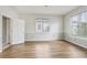 Cozy bedroom with wood floors and ample natural light from large windows at 25737 Frith St, Land O Lakes, FL 34639