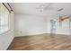 Bright bedroom with wood floors, ceiling fan, and natural light from the window at 25737 Frith St, Land O Lakes, FL 34639