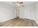 Bedroom featuring wood-look flooring, a unique ceiling fan, and closet for storage at 25737 Frith St, Land O Lakes, FL 34639