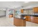 Spacious kitchen with tiled floors, stainless appliances, and backyard view at 25737 Frith St, Land O Lakes, FL 34639