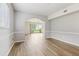 Bright living room with wood flooring and sliding glass doors leading to the outside at 25737 Frith St, Land O Lakes, FL 34639
