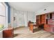 Spacious office with wood floors and built-in shelving, ideal for remote work at 25737 Frith St, Land O Lakes, FL 34639