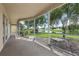 Screened-in patio overlooking the landscaped backyard and pond at 25737 Frith St, Land O Lakes, FL 34639
