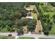 Aerial view highlighting property lines of a wooded homesite with mature trees, offering privacy and space at 2610 Crestview Rd, Wimauma, FL 33598