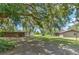 Mature trees and a spacious backyard featuring additional building at 2610 Crestview Rd, Wimauma, FL 33598