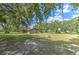 View of a spacious backyard featuring additional building at 2610 Crestview Rd, Wimauma, FL 33598
