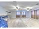 Large finished basement provides a flexible living space with multiple windows and modern flooring at 2610 Crestview Rd, Wimauma, FL 33598