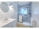 Bathroom featuring marble backsplash in the shower and new vanity at 2610 Crestview Rd, Wimauma, FL 33598