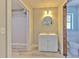 Bathroom with updated vanity, toilet and walk-in closet at 2610 Crestview Rd, Wimauma, FL 33598
