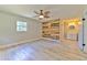 Bedroom with wood accent wall next to an en-suite bathroom at 2610 Crestview Rd, Wimauma, FL 33598
