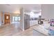 Open-concept kitchen boasts stainless steel appliances and light granite countertops at 2610 Crestview Rd, Wimauma, FL 33598