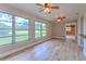 Bright living room with large windows offering a scenic view of the outdoors at 2610 Crestview Rd, Wimauma, FL 33598