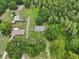 Aerial view of the property showcasing its location surrounded by lush greenery and clearly marked lot lines at 26223 Chianina Dr, Wesley Chapel, FL 33544