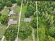 Aerial view of the property showcasing its location surrounded by lush greenery and clearly marked lot lines at 26223 Chianina Dr, Wesley Chapel, FL 33544