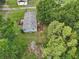 Aerial view showcasing the house with dual wooden decks and a large, well-maintained gray roof at 26223 Chianina Dr, Wesley Chapel, FL 33544