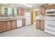 Well-lit kitchen equipped with matching white appliances and wooden cabinetry at 26223 Chianina Dr, Wesley Chapel, FL 33544