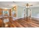 Spacious living area showcases hardwood floors and wood paneled accent walls at 26223 Chianina Dr, Wesley Chapel, FL 33544