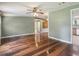 Inviting living room featuring hardwood floors and ample natural light at 26223 Chianina Dr, Wesley Chapel, FL 33544