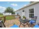 Rear deck features outdoor seating and shade trees at 26223 Chianina Dr, Wesley Chapel, FL 33544