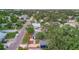 Birds-eye view of a home in a quiet neighborhood with well-kept landscaping and mature trees at 301 Kingston S St, St Petersburg, FL 33711