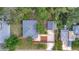 Aerial view of a home with a spacious backyard, garage, and well-maintained landscaping at 301 Kingston S St, St Petersburg, FL 33711