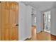 Hallway features hardwood floors and leads to bedroom and bathroom at 301 Kingston S St, St Petersburg, FL 33711