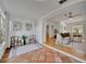 Open-concept living room featuring hardwood floors, neutral decor, and an abundance of natural light at 301 Kingston S St, St Petersburg, FL 33711