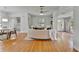 Inviting living room features hardwood floors, a round sofa and an abundance of light at 301 Kingston S St, St Petersburg, FL 33711