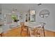 Bright living room featuring hardwood floors and modern decor, with a view to the outside at 301 Kingston S St, St Petersburg, FL 33711