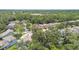This aerial shot displays homes in a wooded neighborhood known for its serene setting and beautiful landscaping at 3530 Brook Crossing Dr, Brandon, FL 33511