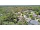A high aerial shows homes nestled amongst trees in a quiet neighborhood offering peaceful and private living at 3530 Brook Crossing Dr, Brandon, FL 33511
