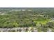 An aerial view features homes backing up to a dense wooded area, providing privacy and natural beauty at 3530 Brook Crossing Dr, Brandon, FL 33511
