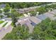 This aerial view shows a well-maintained neighborhood with solar panels, sidewalks, and manicured lawns at 3530 Brook Crossing Dr, Brandon, FL 33511