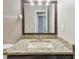 Bathroom featuring granite vanity top and mirror at 3530 Brook Crossing Dr, Brandon, FL 33511
