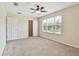 Bright bedroom with a ceiling fan, closet, and a window at 3530 Brook Crossing Dr, Brandon, FL 33511