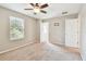Bright bedroom with ceiling fan and neutral carpet. Natural light filters through the window at 3530 Brook Crossing Dr, Brandon, FL 33511