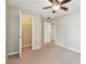 Bedroom featuring neutral walls, carpet, ceiling fan and walk in closet at 3530 Brook Crossing Dr, Brandon, FL 33511