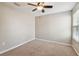 This bedroom has neutral walls, carpet, and a ceiling fan at 3530 Brook Crossing Dr, Brandon, FL 33511