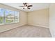 Bright bedroom with large window, offering natural light and a view of the outdoors at 3530 Brook Crossing Dr, Brandon, FL 33511