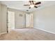 Spacious bedroom featuring neutral walls, carpet, closet, and ceiling fan at 3530 Brook Crossing Dr, Brandon, FL 33511