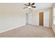 Large bedroom with a ceiling fan and multiple closets for ample storage at 3530 Brook Crossing Dr, Brandon, FL 33511