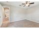 Bedroom featuring plush carpet, neutral walls, and a ceiling fan at 3530 Brook Crossing Dr, Brandon, FL 33511