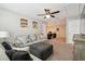 Inviting bonus room showcasing a comfortable seating area with stylish decor and a ceiling fan at 3530 Brook Crossing Dr, Brandon, FL 33511