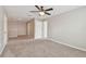 Spacious upper bonus room with neutral walls, carpet, and a ceiling fan at 3530 Brook Crossing Dr, Brandon, FL 33511