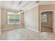Dining area featuring tile flooring, a modern light fixture, and a view through to another room at 3530 Brook Crossing Dr, Brandon, FL 33511