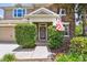 Close-up of the home's entrance and well maintained shrubs on either side of the front door at 3530 Brook Crossing Dr, Brandon, FL 33511