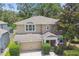 Two-story home featuring mature trees and landscaping at 3530 Brook Crossing Dr, Brandon, FL 33511