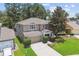 Two-story home featuring mature trees and landscaping at 3530 Brook Crossing Dr, Brandon, FL 33511
