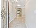 Bright foyer featuring tile flooring and a view leading to the staircase and open living spaces at 3530 Brook Crossing Dr, Brandon, FL 33511