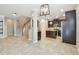 Open floor plan featuring the kitchen, living area, and staircase at 3530 Brook Crossing Dr, Brandon, FL 33511